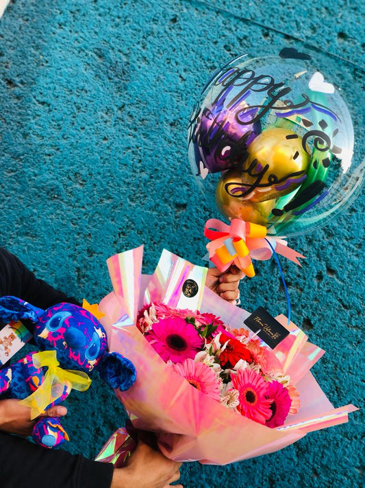 Gerberas, peluche y globo