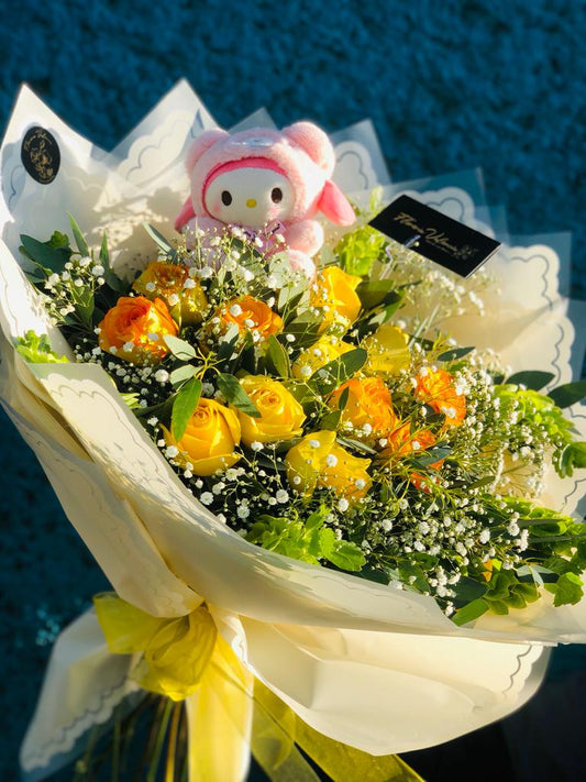 Rosas amarillas y peluche